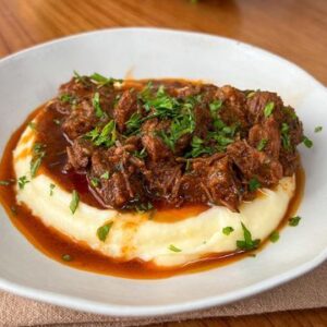 Pastel de batata relleno de bondiola desmenuzada